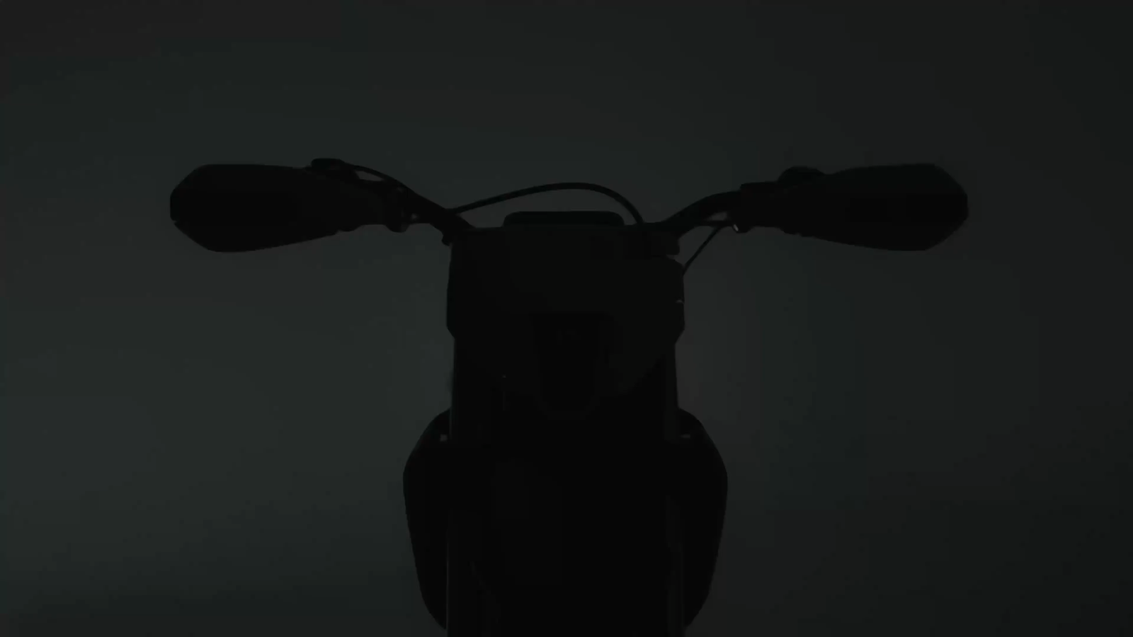 Yellow and black off-road dirt bike with knobby tires and visible suspension components.