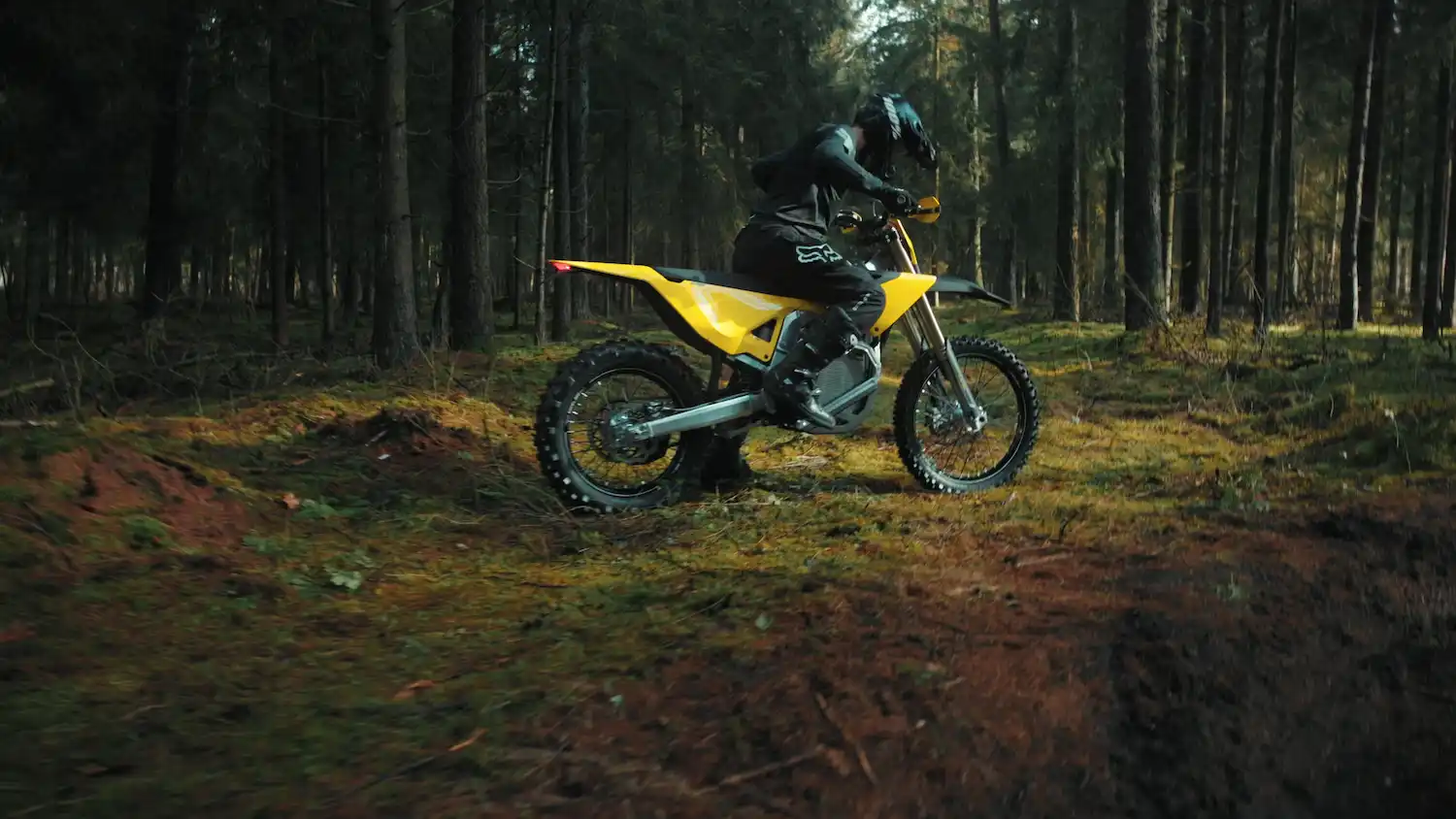 Yellow and black off-road dirt bike with knobby tires and visible suspension components.